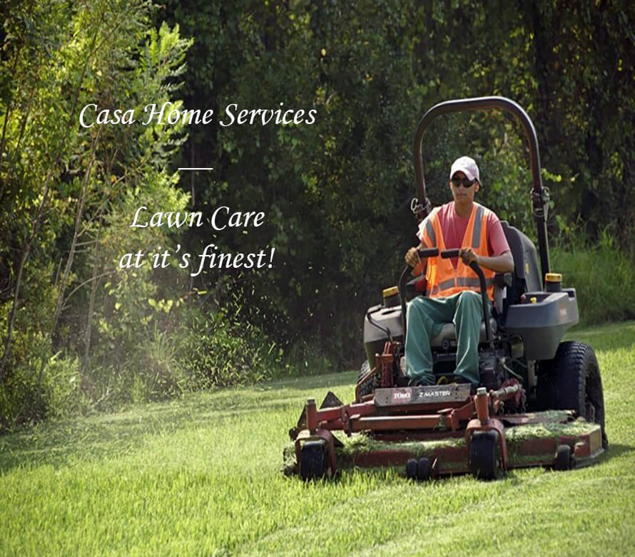 A person mowing a lawn.
